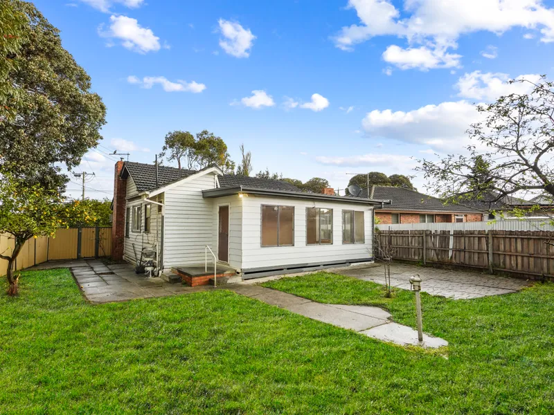 Charming 50's Home: Corner Block with Development Potential