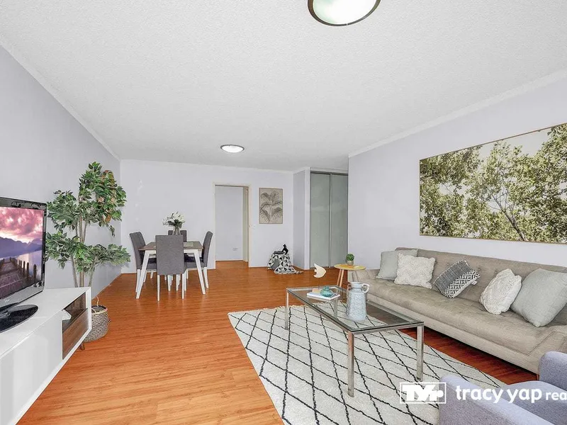 This exceptional three-bedroom full brick apartment boasts a spacious and light-filled interior