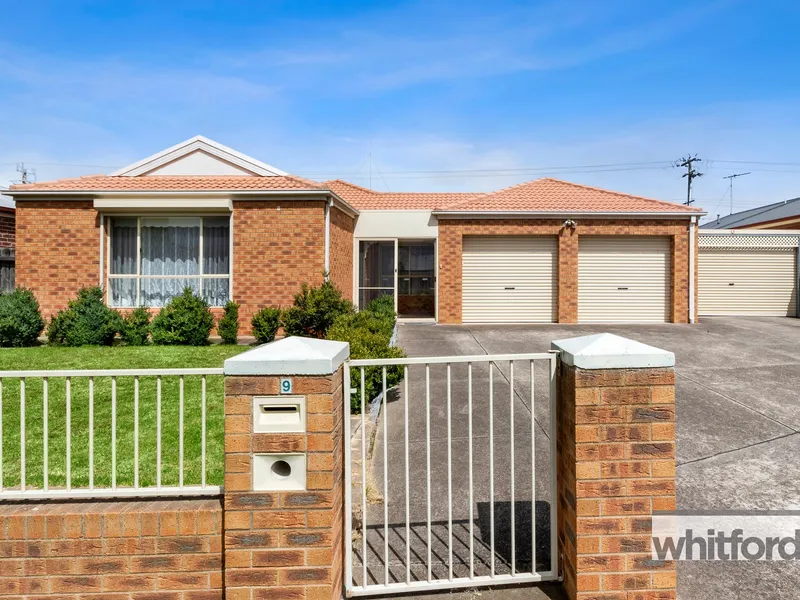 Low maintenance living with garaging for 5 cars!