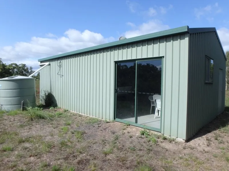 More than acre with shed! Tucked away!