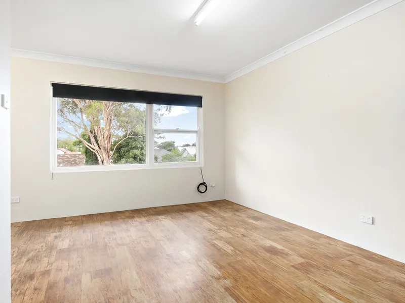 Refreshed flat in village centre