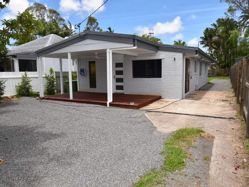 Fully renovated cottage style home with a large fenced backyard