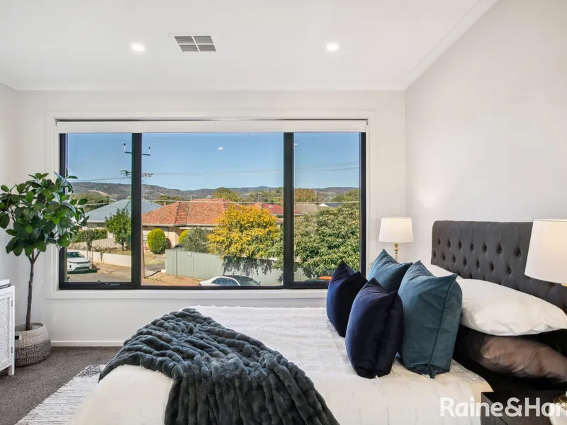 Wake up to a stunning view of Adelaide Hill in this contemporary residence