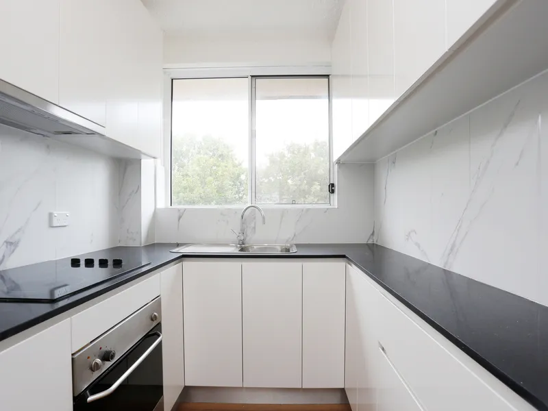 RENOVATED TOP FLOOR UNIT 