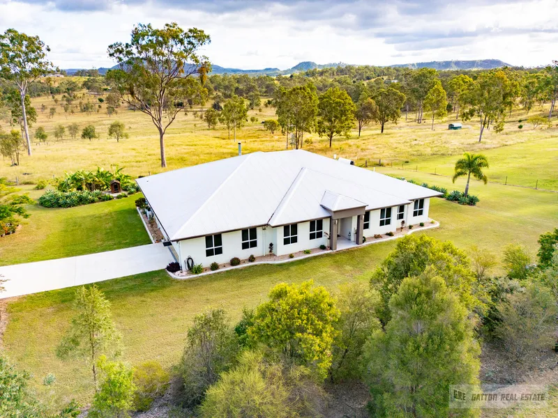 LUXURY RETREAT WITH PANORAMIC VIEWS ON A STUNNING 5 ACRES