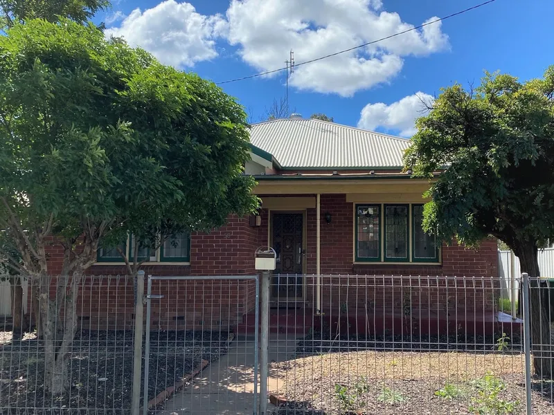 Low Maintenance Home Packed with Potential – Walk to CBD