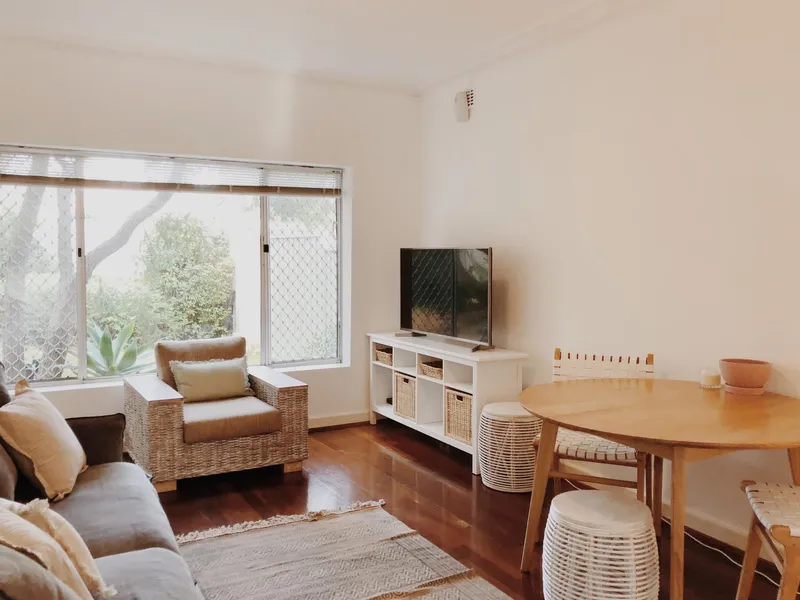 TWO BEDROOM, ground floor unit, with two HUGE courtyards, in small group of 4