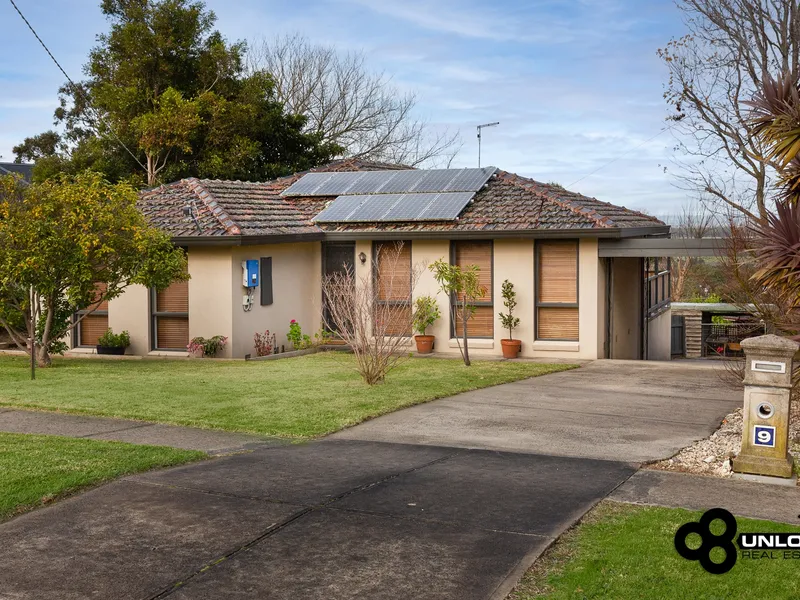 Solid brick family home on a large block in Garfield!