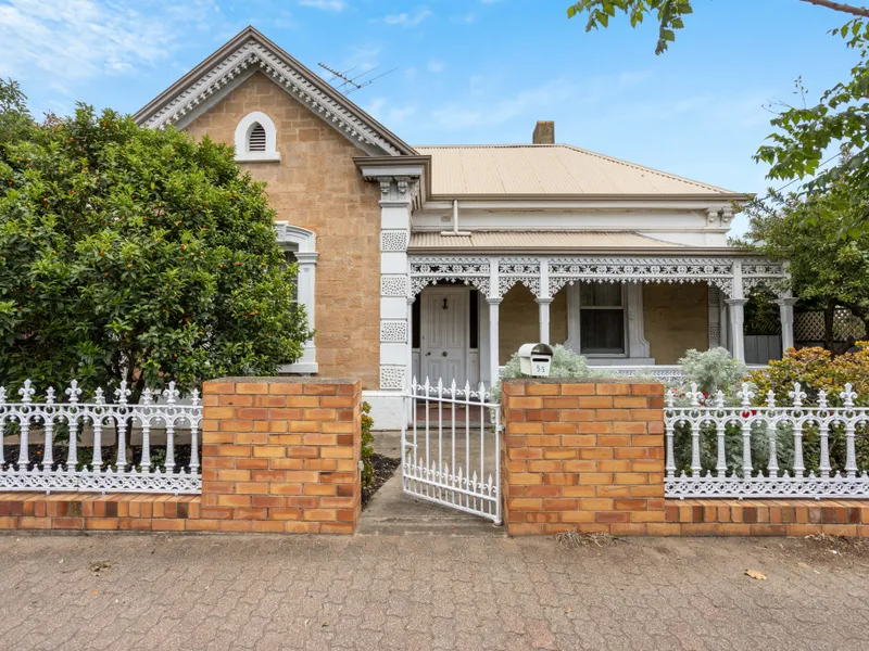 Charming Freestone Villa with Potential: Timeless Elegance, Versatile Spaces In A Prime Location