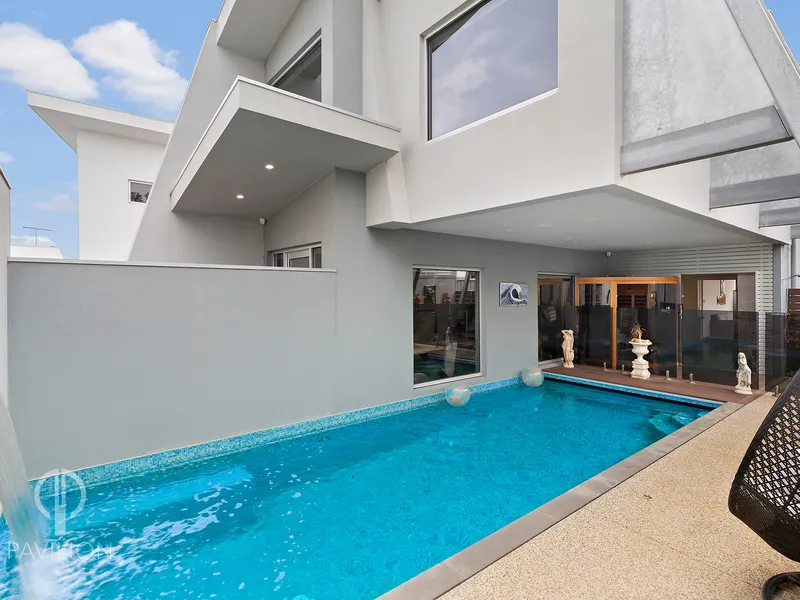 Designer beach-side home with dual living opportunity.