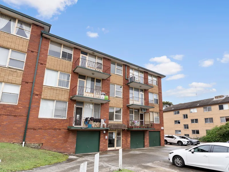 Centrally located 2 bedroom unit - freshly painted & brand new carpet