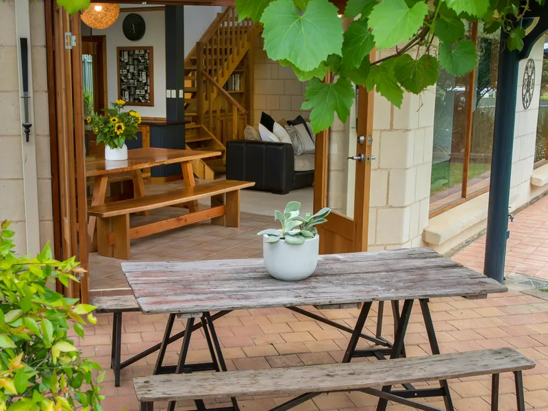 Retreat to a unique limestone-laden Hills home with holiday vibes and architectural cues…