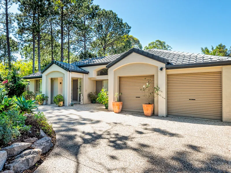MODERN CONTEMPORARY HOME IN TROPICAL SETTING