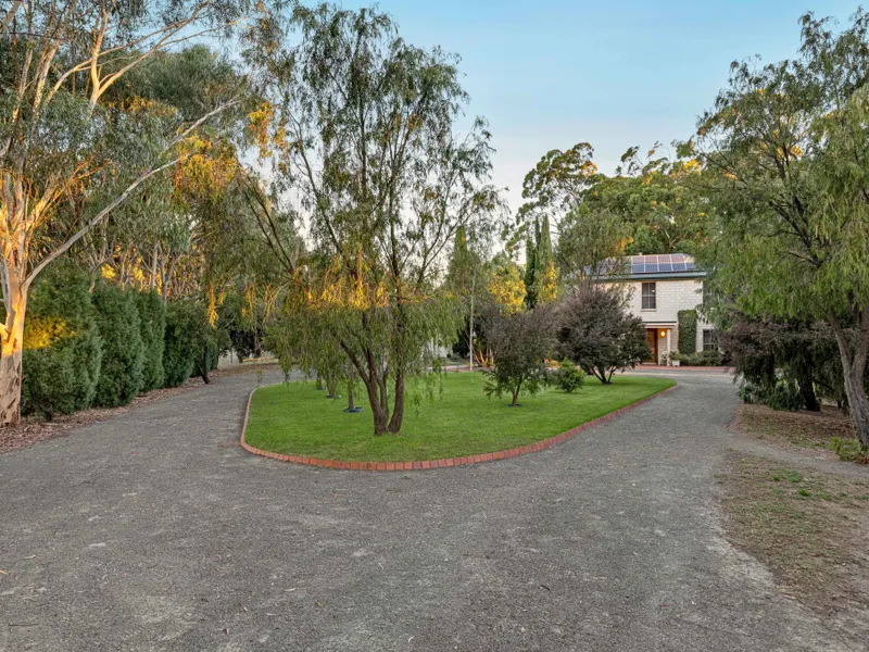 A lifestyle offering on some 12.8 acres of picturesque land with panoramic country views, custom built home, substantial shedding & quality bore.