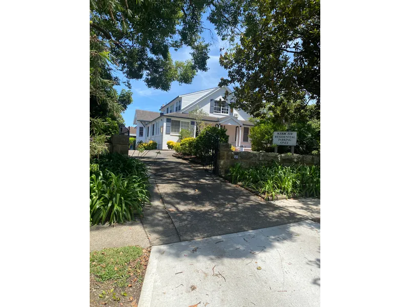 Unique property on tree lined street.