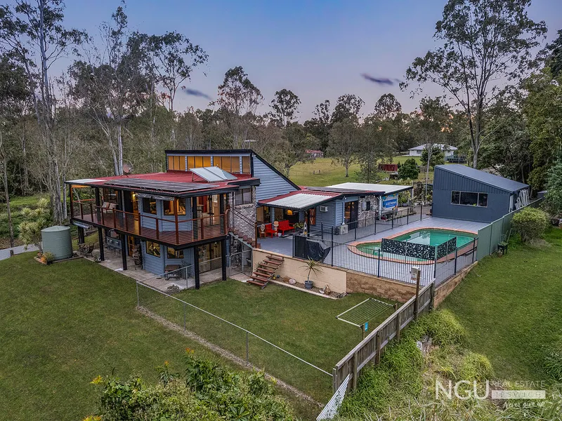 SECLUDED ACREAGE RETREAT WITH WATERFRONT VIEWS AND ACCESS PERFECT FOR ALL THOSE LAND OR WATER SPORTS ENTHUSIASTS!