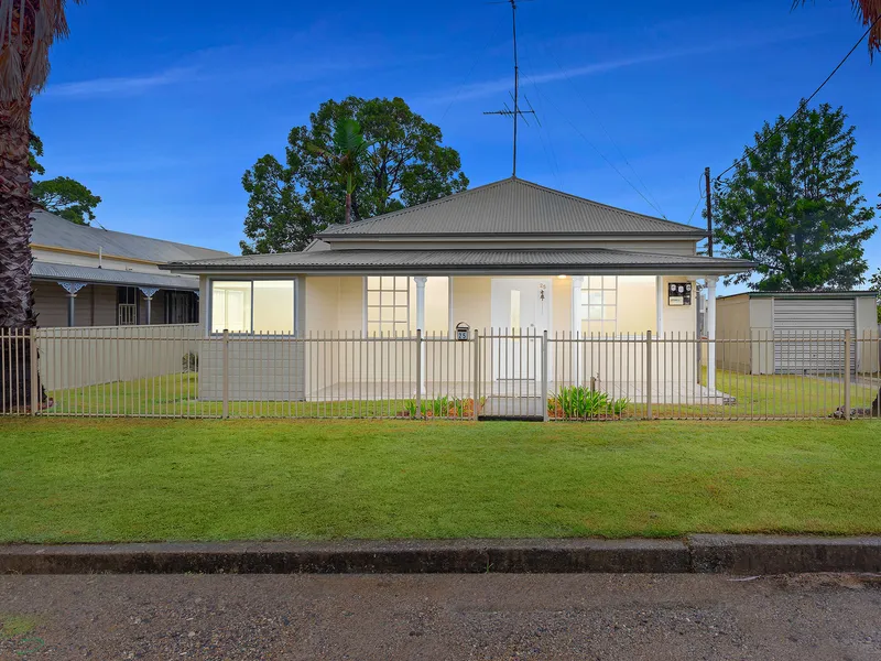 Refreshed home with rear lane access        
