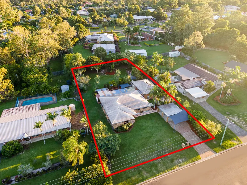 TWO HOMES ON A HALF ACRE  