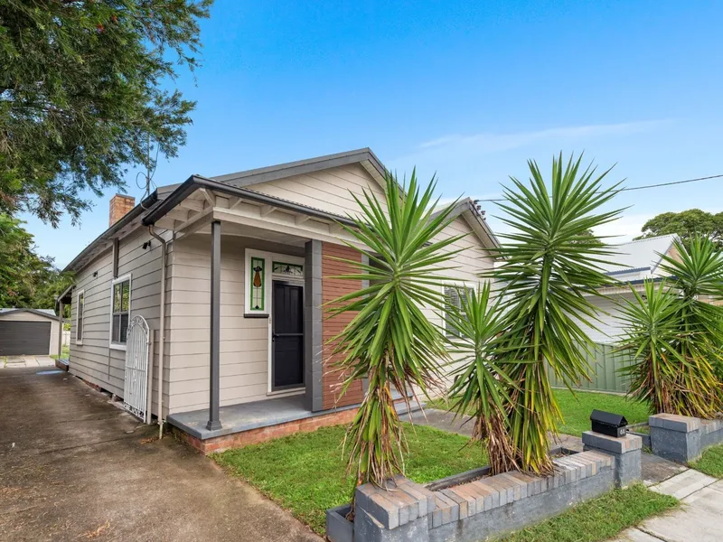 A Stunning Renovation Graces Every Square Inch of this Conveniently Located Home