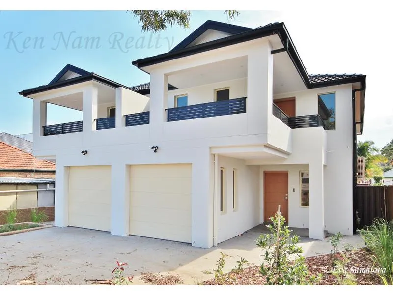 MODERN FULL BRICK DUPLEX.