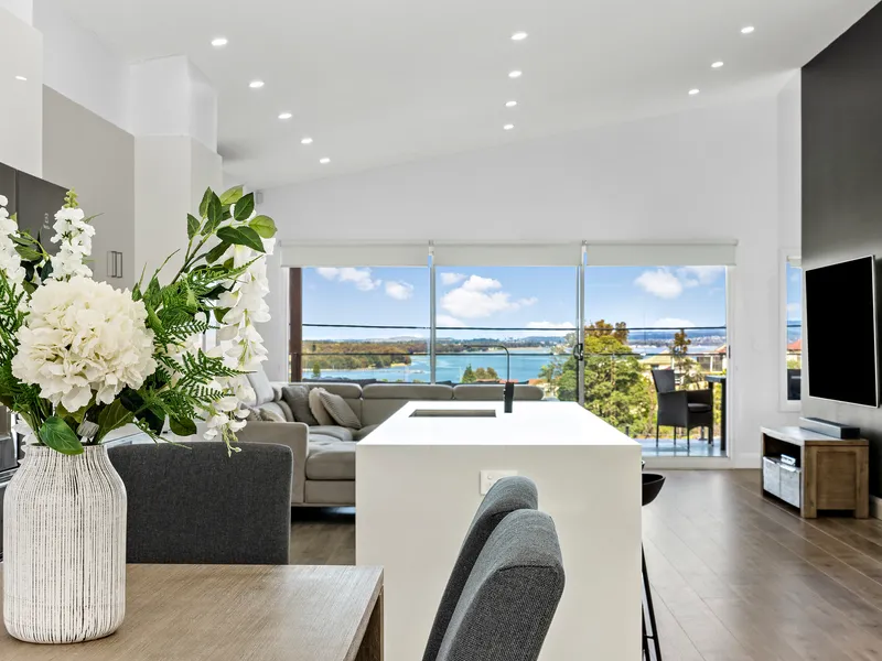 Master built home with sweeping lake views