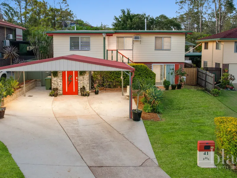 massive deck, side access & versatile downstairs area