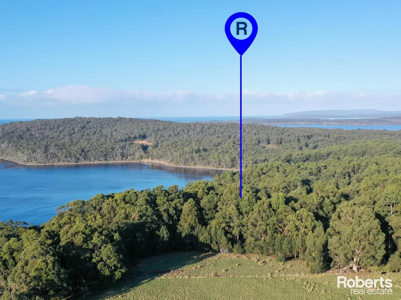 Stunning Southport Acreage with Water Frontage
