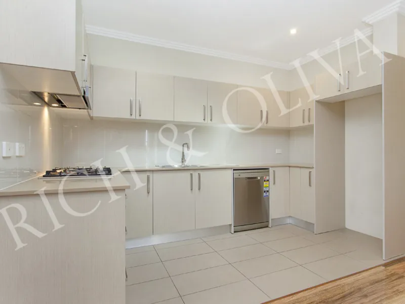 Bright & Spacious Top Floor Unit!