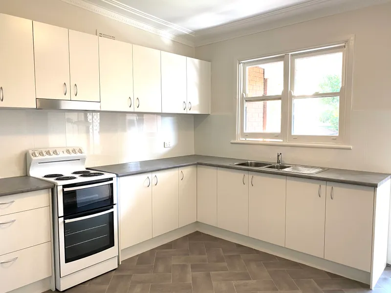 Brand new kitchen - freshly polished floorboards 
