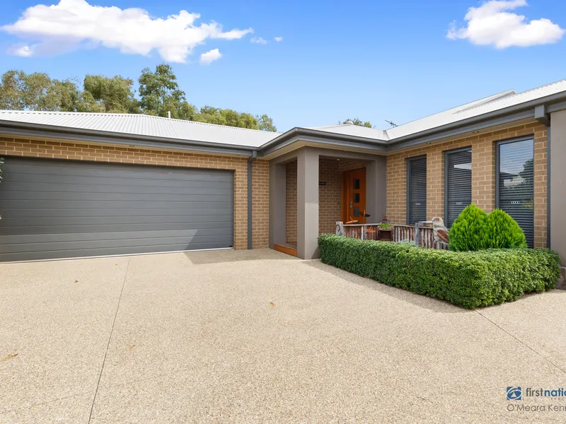 Open to the light and garden of this accommodating home