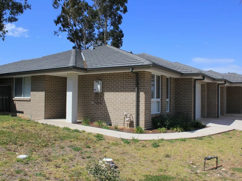 Centrally located, low-maintenance duplex