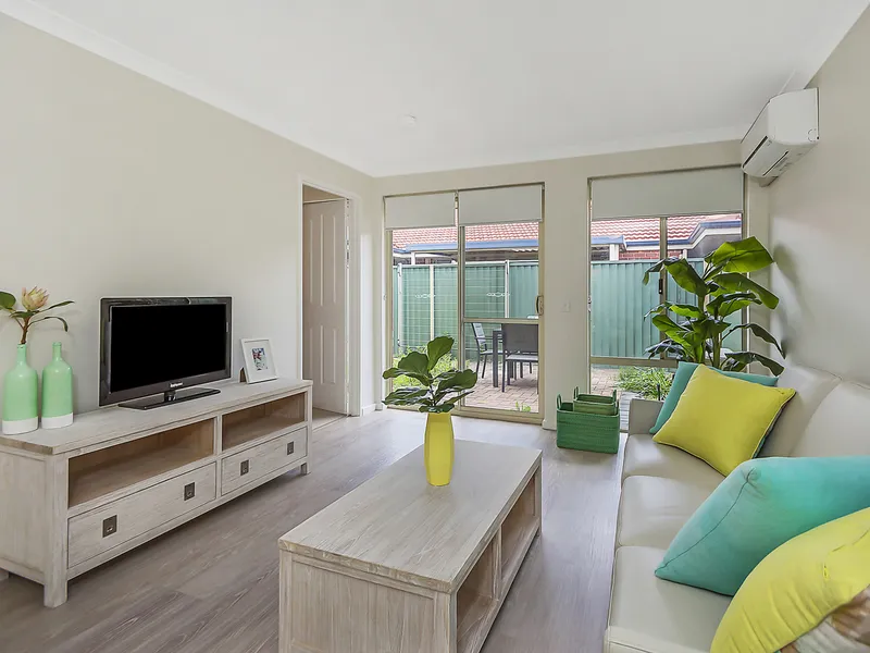 Newly renovated villa with new flooring, window treatments, paint, air conditioning and more!