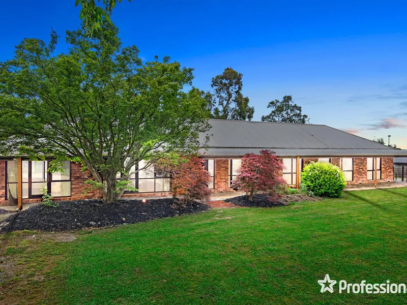 EXCLUSIVELY POSITIONED WITH MOUNTAIN VIEWS AND A TENNIS COURT