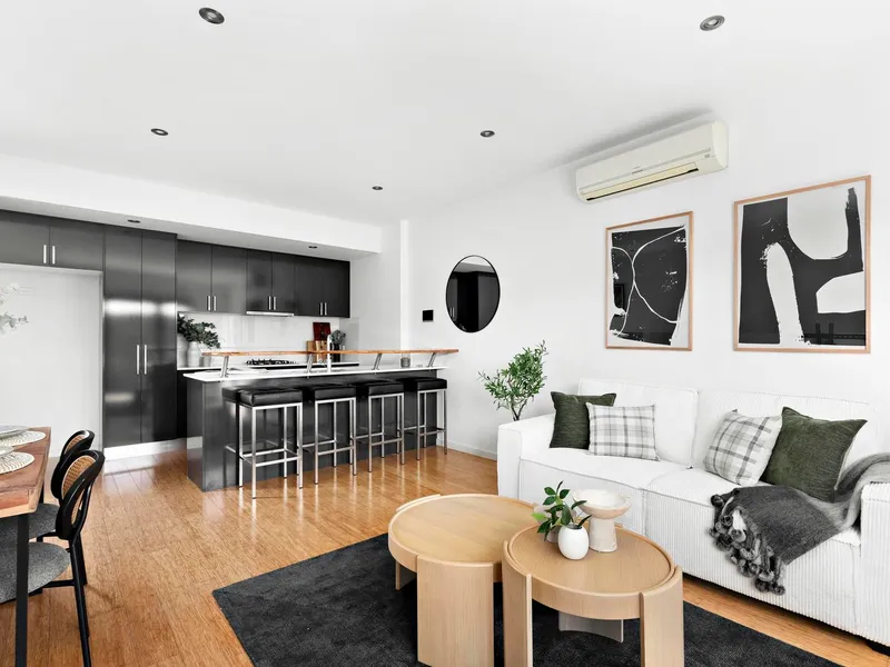 Modern design meets urban convenience in this stunning two-bedroom Townhouse