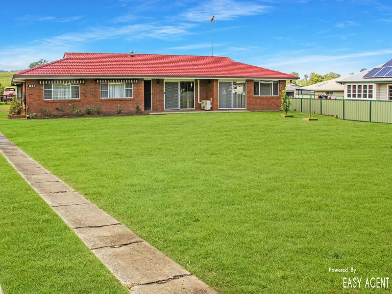 BRICK AND TILE HOME ON LARGE FLAT BLOCK