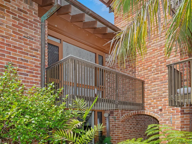 Secure, serviced studio apartment offers sunny balcony and palm-fringed outlook