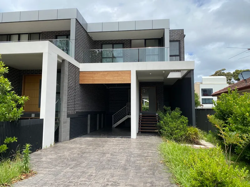 Contemporary Brick Duplex in Highly Desired Location