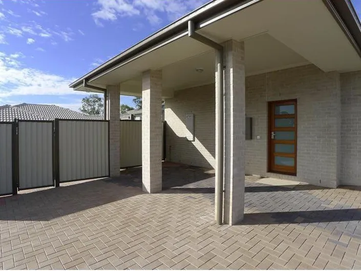 Modern Low-set Brick and Tile Duplex