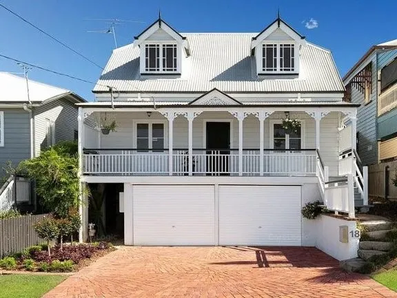 CHARACTER HOME with TWO STREET ACCESS, SPACIOUS DECK and MANICURED GARDENS