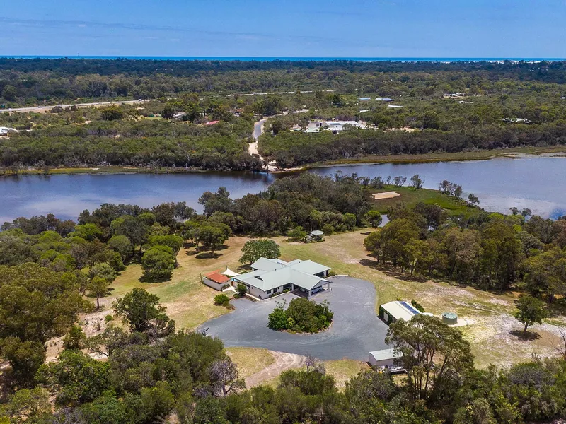 Prestigious Riverfront Acreage Retreat!